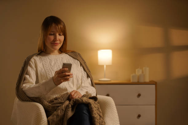 istock Smart woman sitting armchair and reading a text message 1179741723