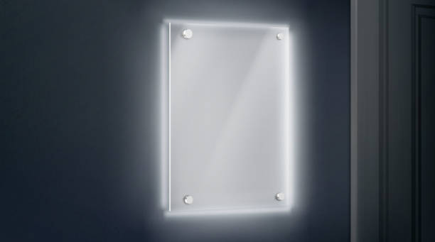 istock Empty glass name plate bolted to wall near doorway 1179741789
