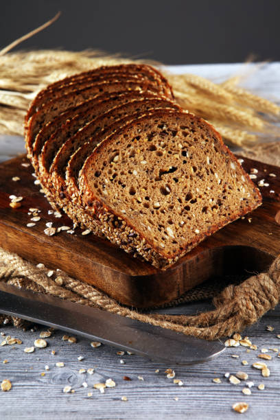 istock freshly baked bread on wooden board. cutted organic bread 1179741828