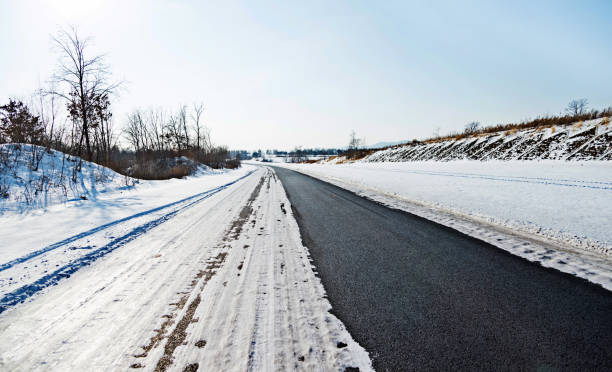 istock Country road covering with snow 1179742803