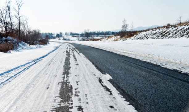 istock Country road covering with snow 1179743208