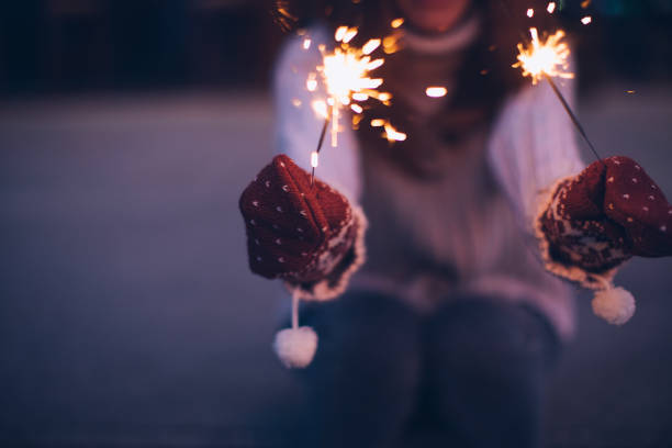 istock Happy girl holding burning sparklers 1179743213