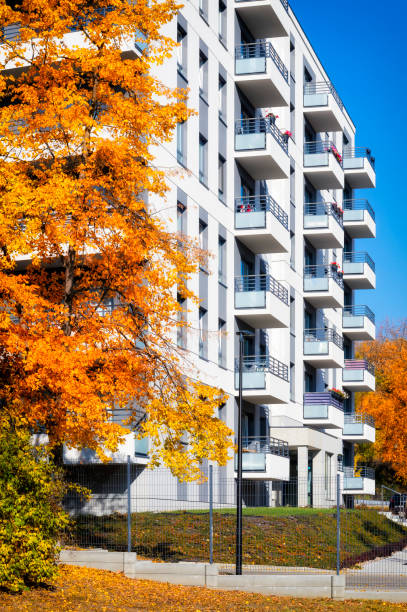 istock Modern  white apartment building in autumn surroundings 1179743257