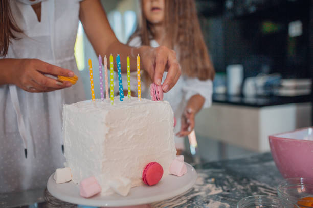 istock Single mother bakes cake with her little daughter 1179743971