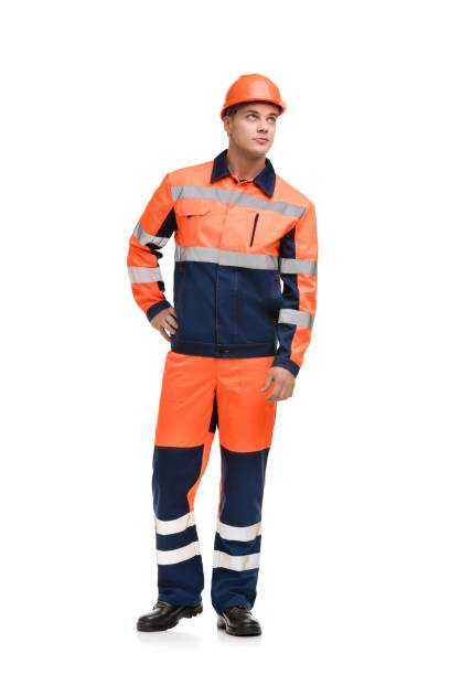 istock Man in working clothes and helmet isolated shot 1179744450