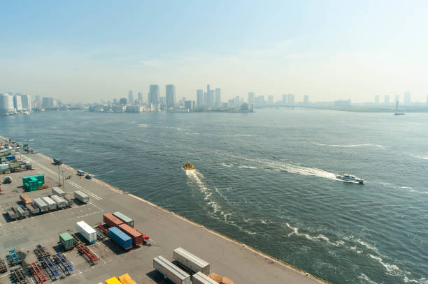 istock Cargo wharf and ship sailing in the sea 1179745801