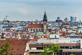 Aerial view of citycape of old town of Prague, with a lot of red rooftops and  The Church of Mother of God before Týn. A gothic church and a dominant feature of the Old Town. View from the Letna park.