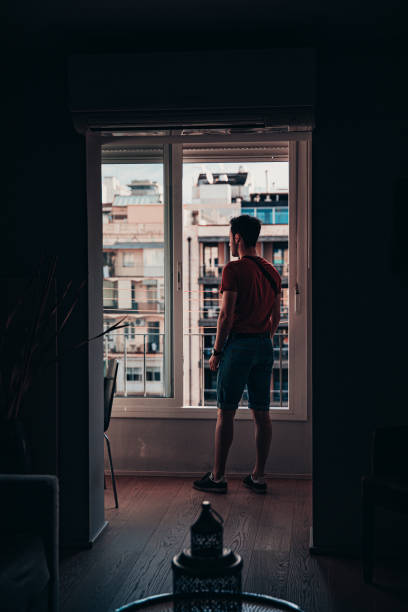 istock Taking In The View From The Apartment Window 1179748630