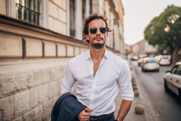 istock Modern gentleman standing on the sidewalk 1179749317