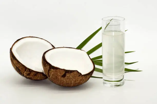 Photo of Opened coconut exposed on white background