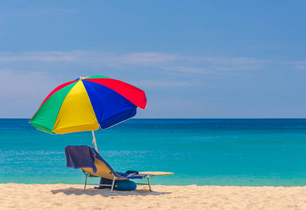 Beach and the sea bed, the bright blue canvas umbrellas and beautiful.