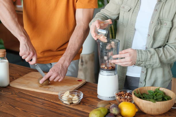 istock Young married couple makes a smoothie 1179753966