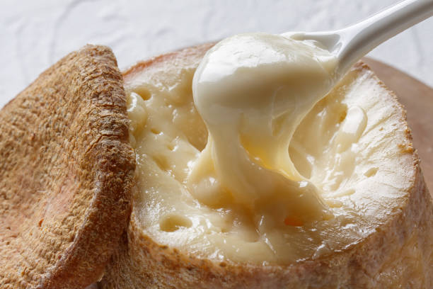 istock Spanish traditional sheep cheese with very creamy texture, almost liquid on white background. 1179754477
