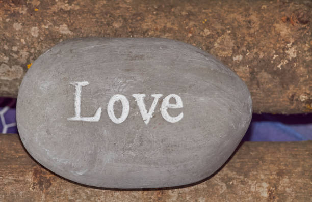 istock Word love engraved on a stone, from above 1179755911