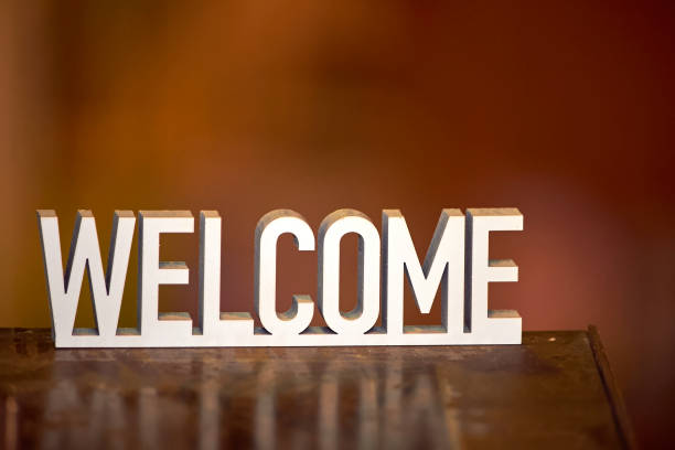 Welcome sign on warm hygge background