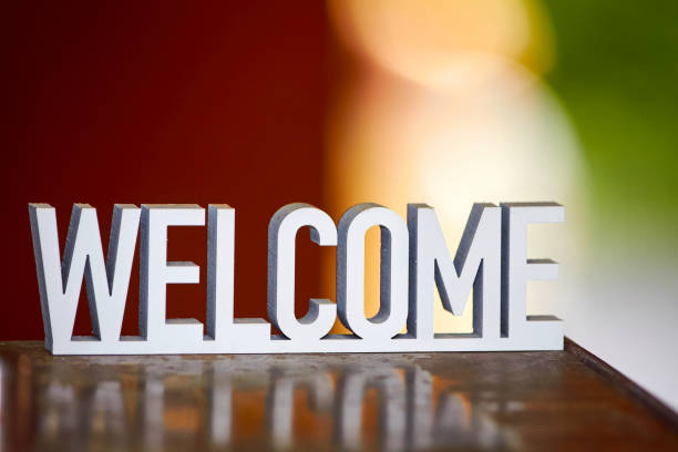 Welcome sign on warm hygge background