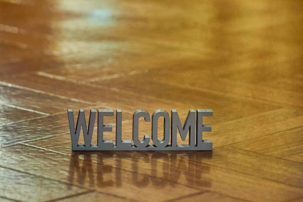 istock Welcome sign on parquet floor background 1179756088