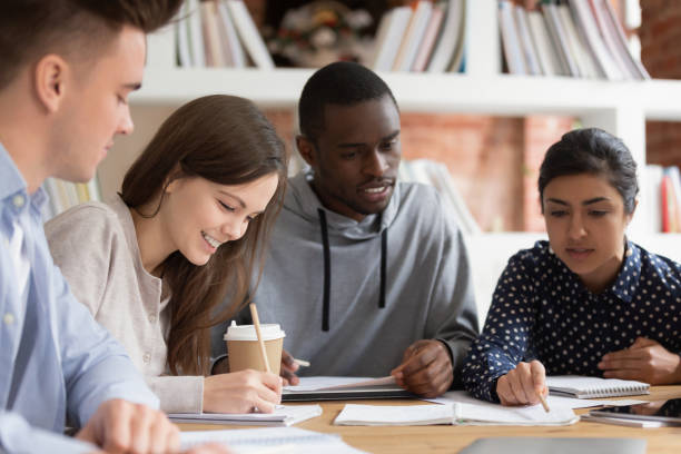 istock Smiling group of diverse students preparing for seminar. 1179756335
