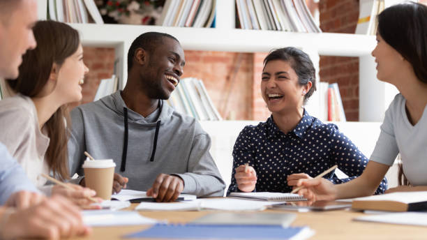 istock Distracted from studying diverse guys and girls laughing. 1179756336
