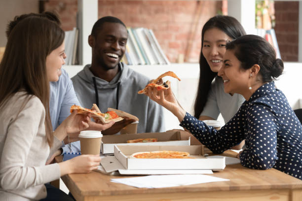 istock Overjoyed young indian female student laughing during lunch time. 1179756421
