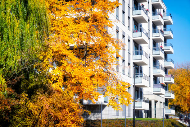istock Modern  white apartment building in autumn surroundings 1179757413
