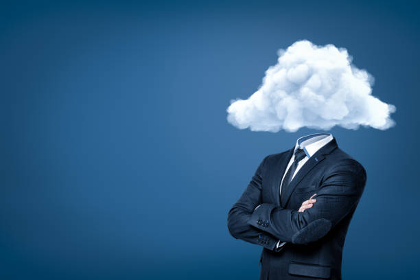 istock Businessman with white cloud instead of head on blue background 1179758610