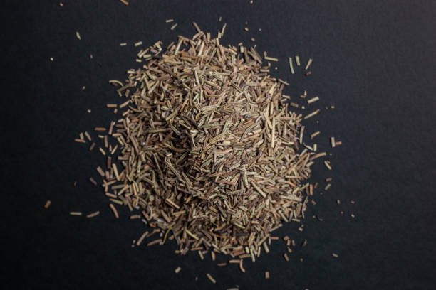 istock Spice caraway seeds sprinkled on a black background 1179761307