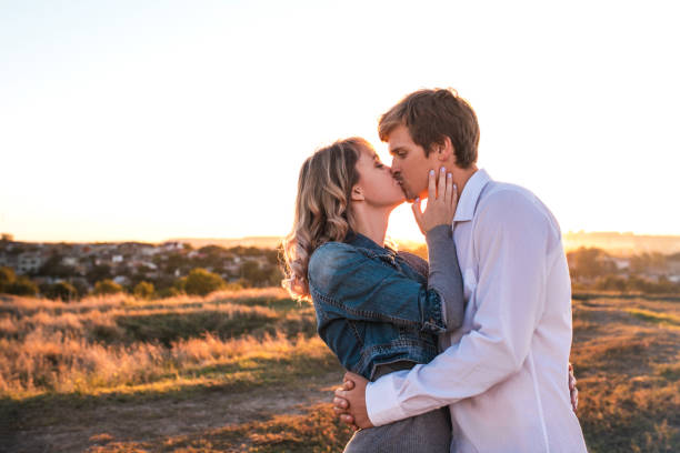 istock Loving couple is about kiss at sunset. 1179761489