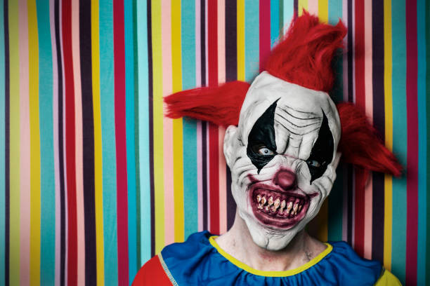 istock scary evil clown in front of a circus tent 1179761715