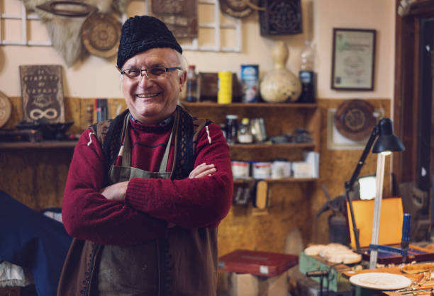 istock Senior artist at his atelier 1179764356