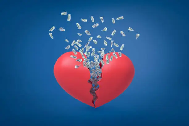 Photo of 3d rendering of valentine heart broken in two with dollars flying out from inside.