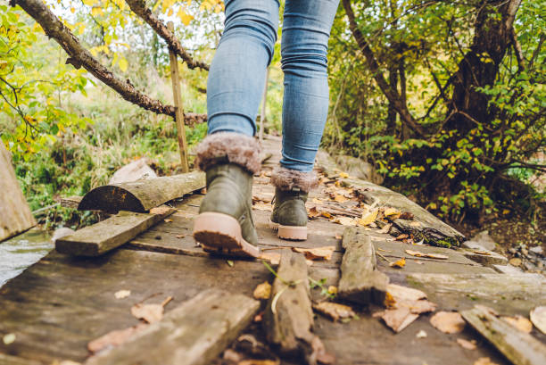 istock Female feet on mountain bridge 1179766151