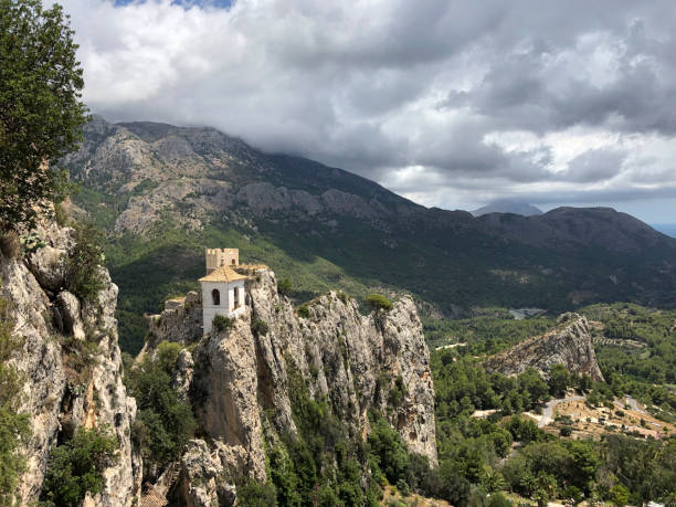 Guadalest, Alicante, Spain | July 28 2019: Castle Tower at Guadalest a popular tourist destination near Benidorm.