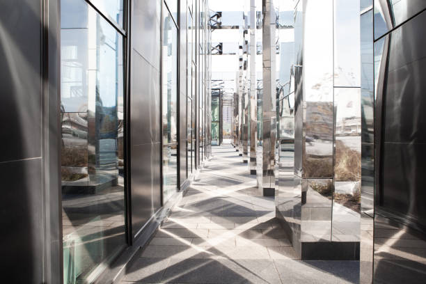 istock Abstract architectural perspective. The sloping or crossing lines of modern office building. Detail glass and mirror background 1179769282