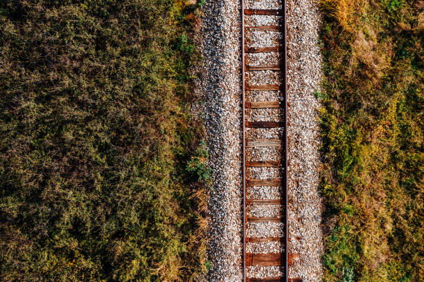 istock Old railroad track through countryside in autumn 1179769442