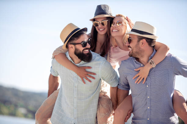 istock Cheerful young friends enjoying on vacation 1179770146