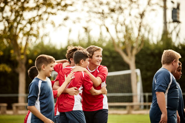 istock Soccer players celebrating success after match 1179770237
