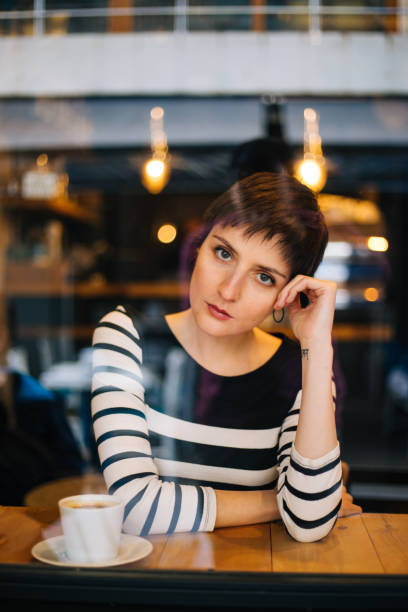 istock Woman drinking coffee at the cafe 1179770357