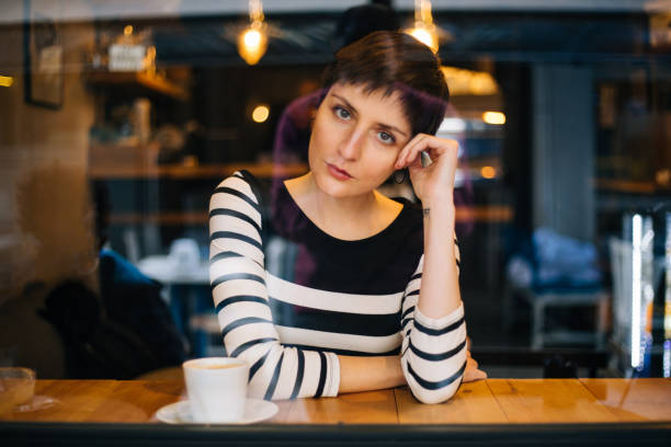 istock Woman drinking coffee at the cafe 1179770365