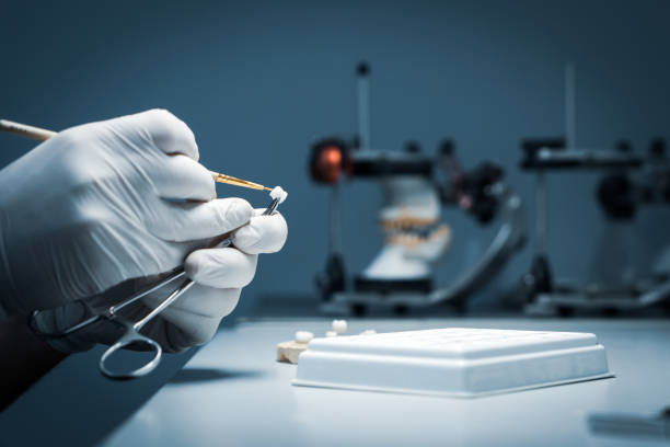 istock processing and correction of the dental crown. laboratory 1179771658