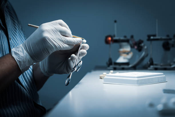 istock processing and correction of the dental crown. laboratory 1179771687