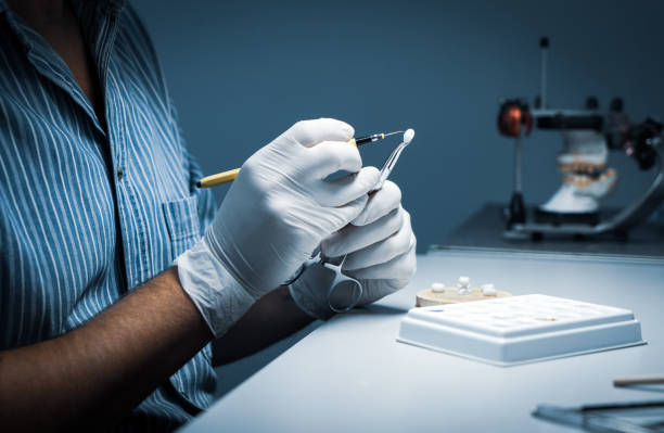 istock processing and correction of the dental crown. laboratory 1179771727