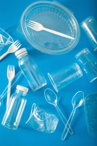 istock single use plastic bottles, cups, forks, spoons. concept of recycling plastic, plastic waste 1179774167