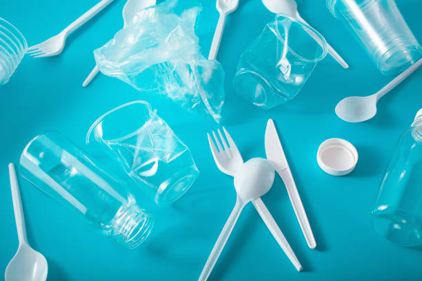 istock single use plastic bottles, cups, forks, spoons. concept of recycling plastic, plastic waste 1179774229
