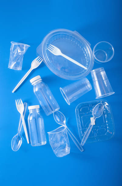 istock single use plastic bottles, cups, forks, spoons. concept of recycling plastic, plastic waste 1179774280