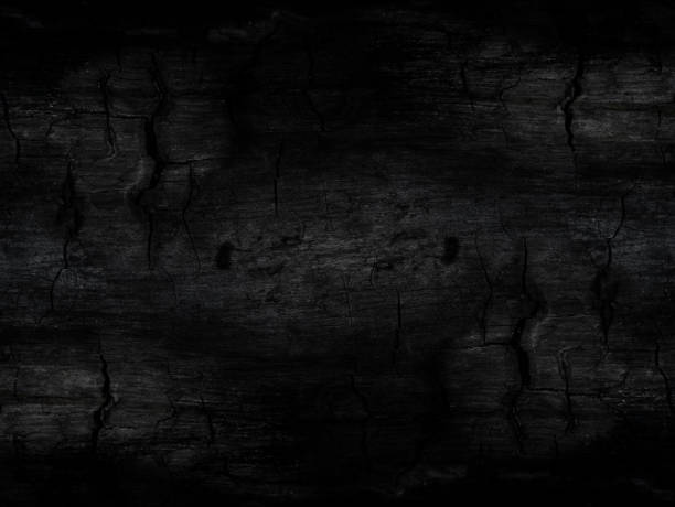 Low key image the Surface of charcoal background.