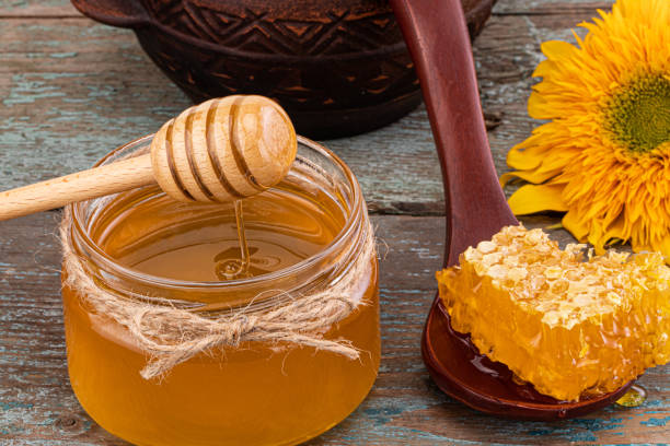 istock Honey background. Fresh honey in the pot with honeycombs 1179777447