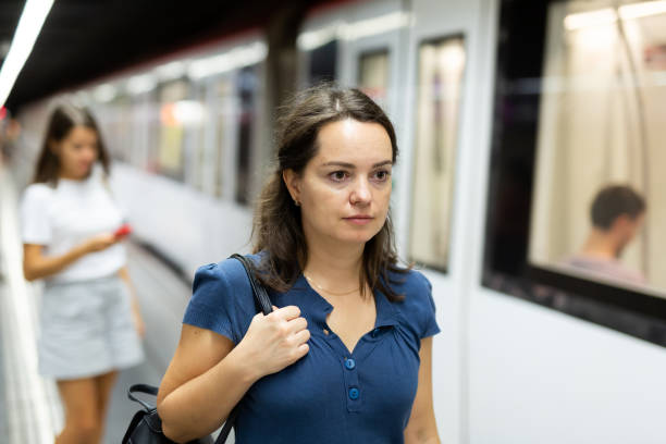 istock Pretty woman walks on the subway platform 1179779390