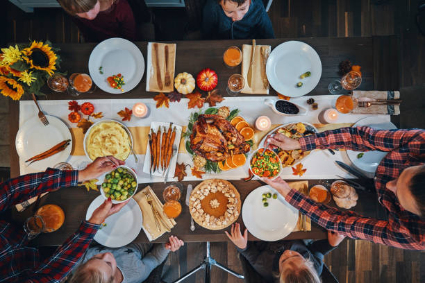 istock Family Having Traditional Holiday Stuffed Turkey Dinner 1179779408