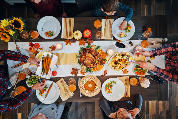 istock Family Having Traditional Holiday Stuffed Turkey Dinner 1179779423